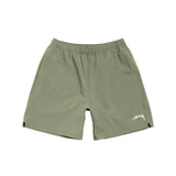 Green shorts with a brand logo on a white background